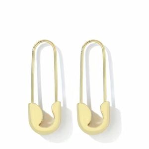 Gold colored safety pin earrings.